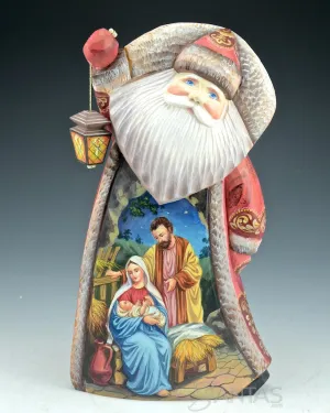 Santa Carving with Lantern and Holy Family Scene