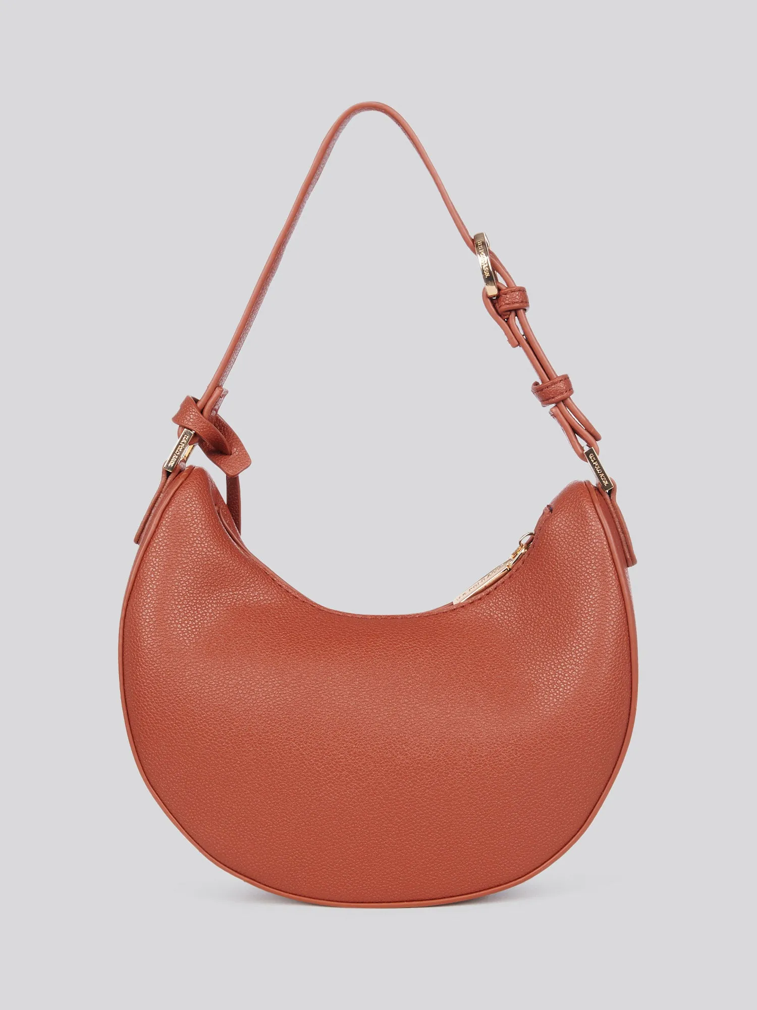 U.S. Polo Assn. Womens Jones Small Round Hobo Bag in Rust