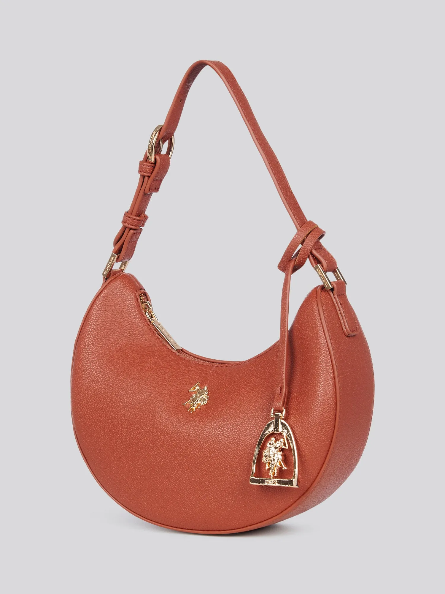 U.S. Polo Assn. Womens Jones Small Round Hobo Bag in Rust