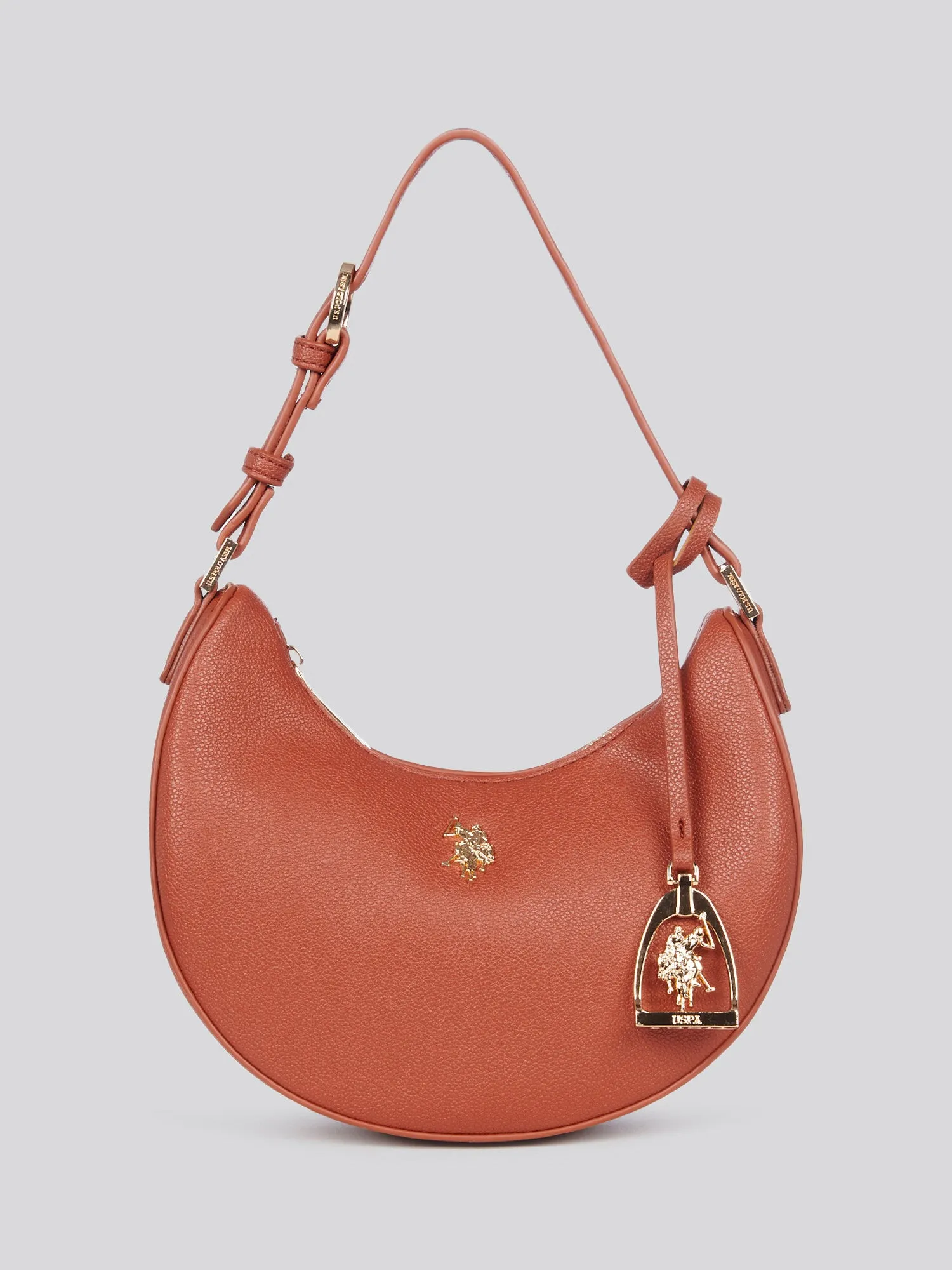 U.S. Polo Assn. Womens Jones Small Round Hobo Bag in Rust