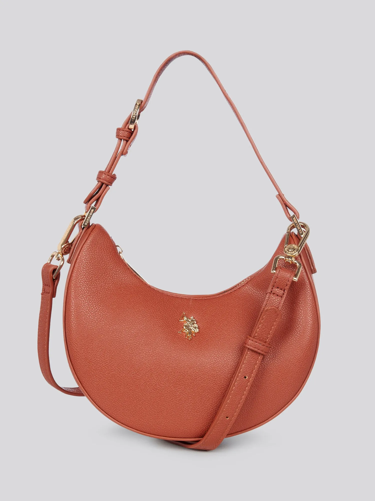 U.S. Polo Assn. Womens Jones Small Round Hobo Bag in Rust